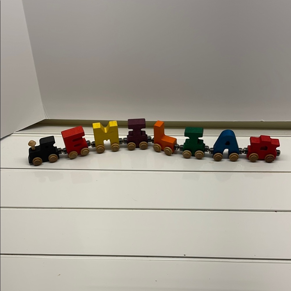 Maple Landmark, 8 piece train set with the name EMILIA